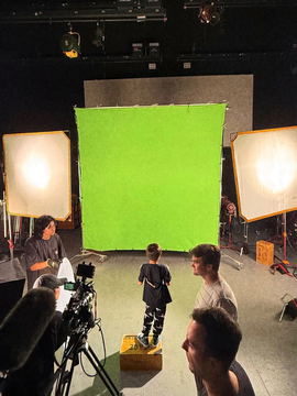 The green screen stage seen from behind the camera